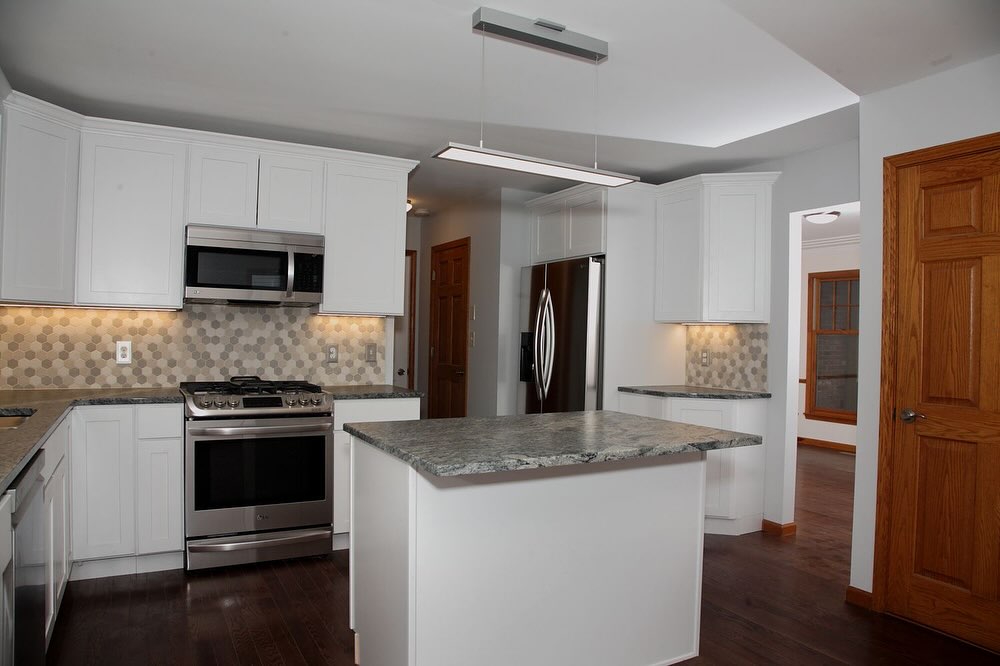 Modern white kitchen with marble island